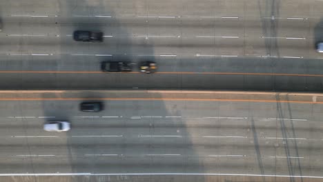 highway traffic aerial drone looking down on 8 lane interstate