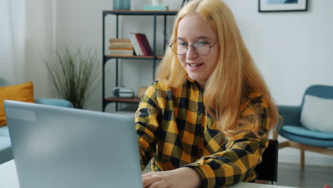 woman using laptop at home