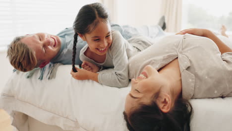 Happy-family,-bed-and-child-laughing-in-a-bedroom