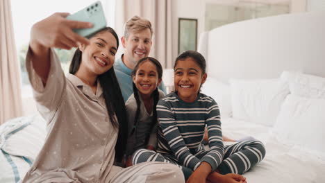 Selfie,-funny-and-happy-family-in-home-bedroom