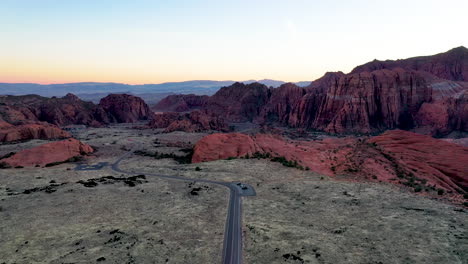 reverse aerial view of road in the snow canyon state park, utah, usa