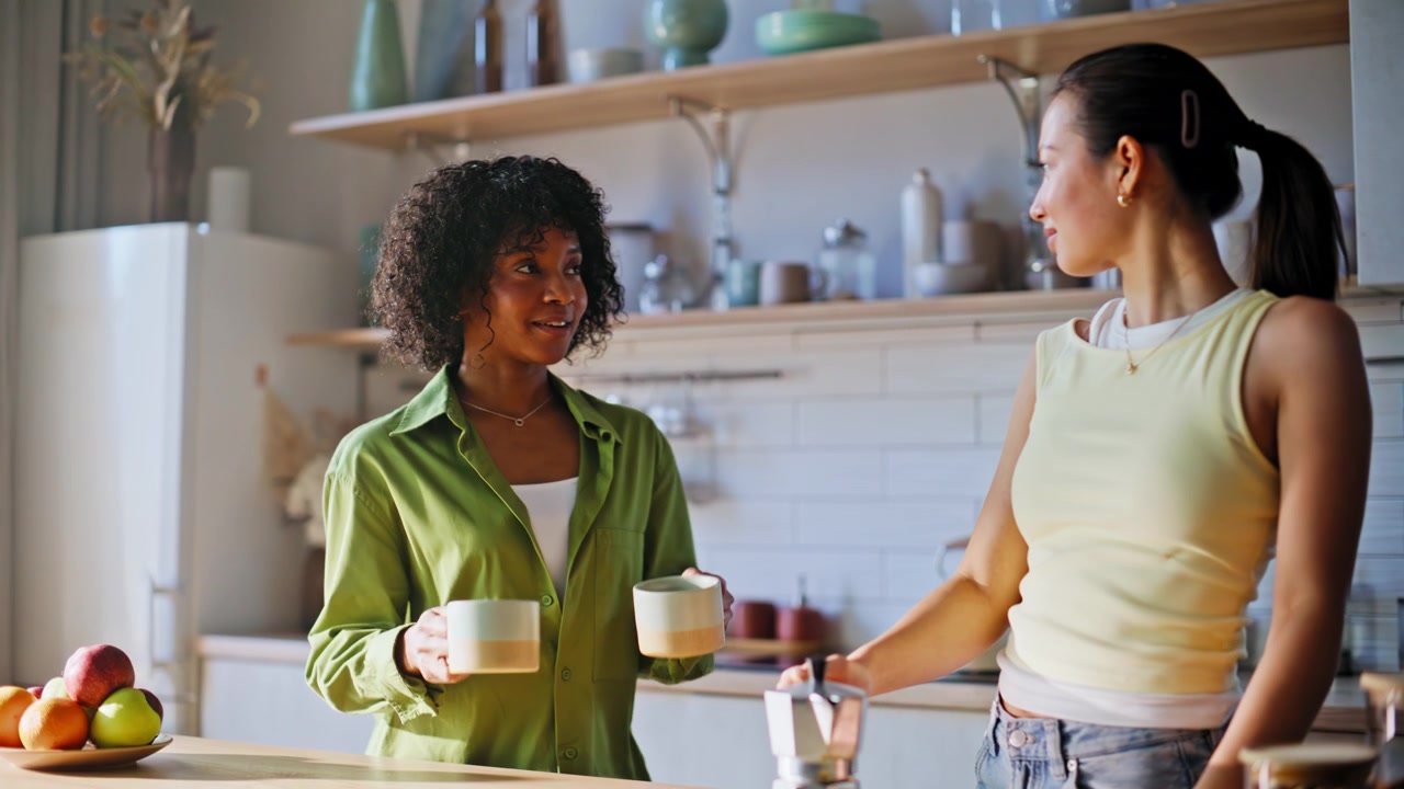 Female friends making coffee kitchen. Woman pouring espresso mugs morning.