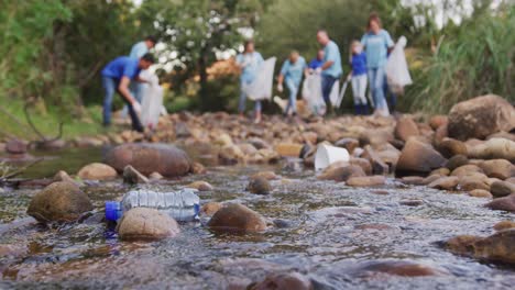 mid adults volunteering during river clean-up day