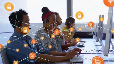 Animation-of-network-of-digital-icons-on-diverse-colleagues-wearing-phone-headset-working-at-office