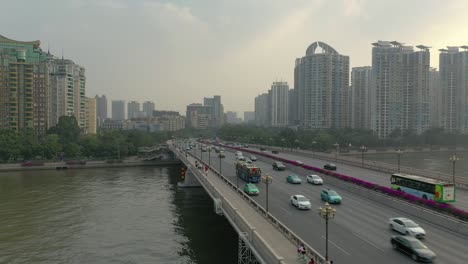 sunny evening guangzhou city pearl river traffic bridge aerial panorama 4k china