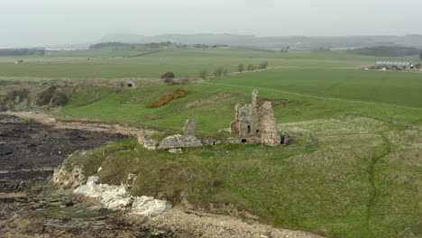 An-aerial-view-of-Newark-Castle-on-the-Fife-coastal-path,-Scotland