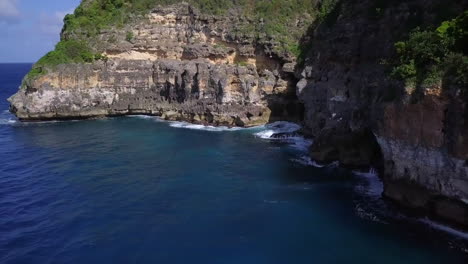 Aerial,-flying-towards-small-rocky-bay