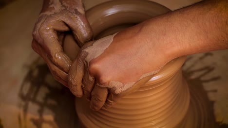 potter at work makes ceramic dishes. india, rajasthan.