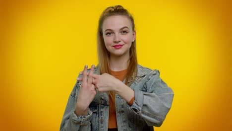 cheerful teen girl showing hashtag symbol with hands, likes tagged message, popular viral content