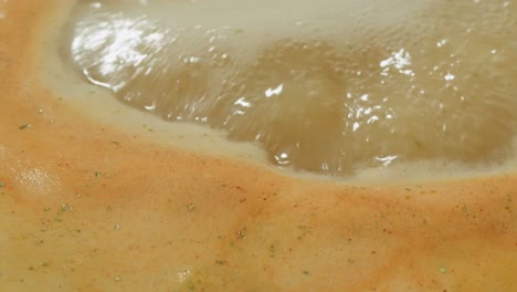 close-up of boiling soup