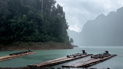 bamboo rafts on rainy day in tropical of khao sok national park in southern thailand