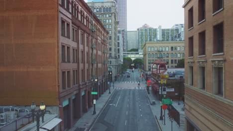 street to cityscape view of central business district office towers, los angeles, drone shot