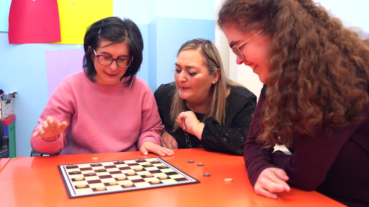 Women playing checkers