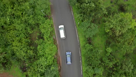 lonavla-city-hill-station-dron-shot-following-car-top-view-birds-eye-view-in-rainy-day-city-
