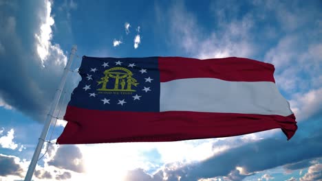 georgia flag on a flagpole waving in the wind in the sky. state of georgia in the united states of america