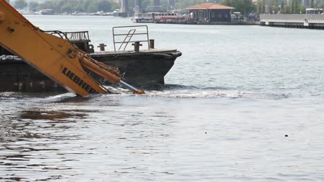 excavator dredging a river