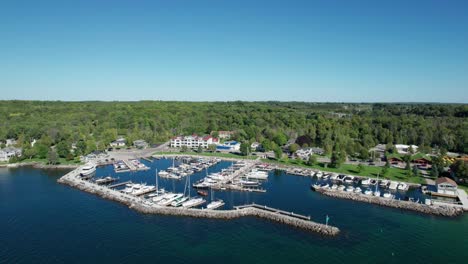 sailboats and other boats in the harbor in sister bay, wisconsin on a sunny day