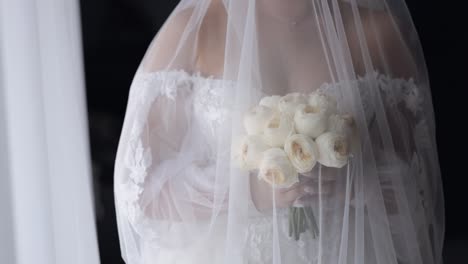 bride in a white dress holding a bouquet of flowers