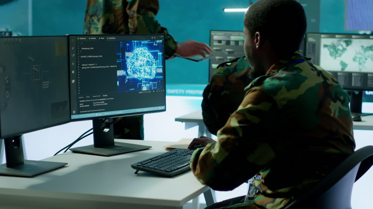 Army soldier handles satellite radar real time data on computer in command post