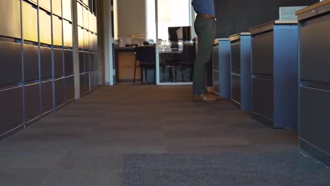 staff walks around the cubicals at the office