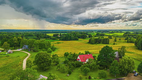 Rainy-weather-at-sunset-over-a-rural,-farming-countryside---pullback-aerial-hyper-lapse