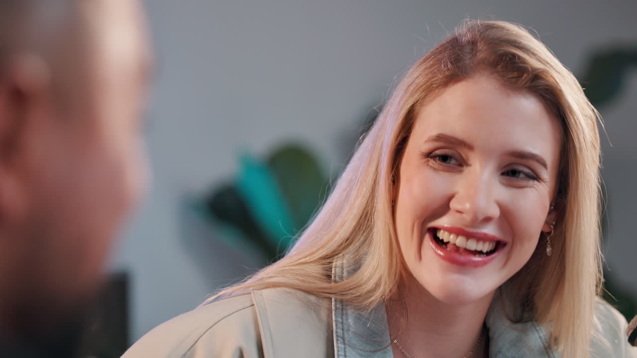 Woman laughing during interview