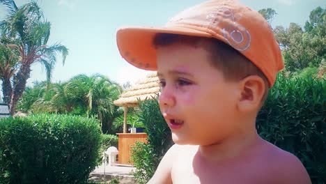 cute toddler boy playing in tropical paradise