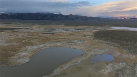 mammoth lakes convict canyon minarets sierra nevadas mountain range hilltop wild willy's hot springs california aerial drone winter vibrant sunset benton crossing long valley caldera circle right