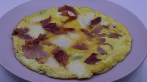 omelette with potatoes, ham and mozzarella cheese