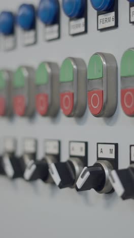 industrial control panel with buttons and switches