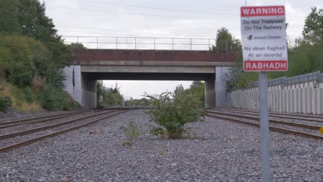 Railway-And-Bridge-On-M50-Motorway-In-Dublin,-Ireland-On-A-Sunny-Day