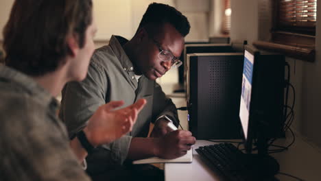 Young men, teamwork and computer