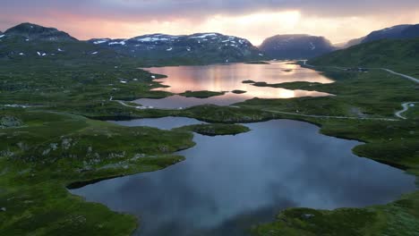 sunset nature landscape in norway - stavatn lake and snow covered mountains peaks - vestland, vestfold og telemark - aerial