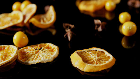 sweet lemon and cape gooseberry on black background 4k