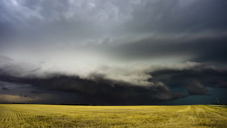 big storm moving closer with farmed fields in view