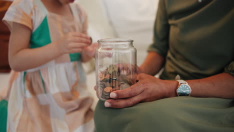 coins, jar or hands of mother with child counting