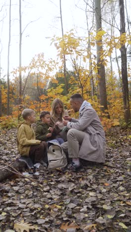 Family-sitting-around-a-dead-tree