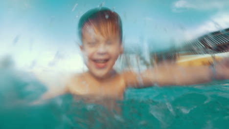 he likes to splash water in the pool it so funny