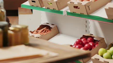 small business owner preparing organic products on shelves