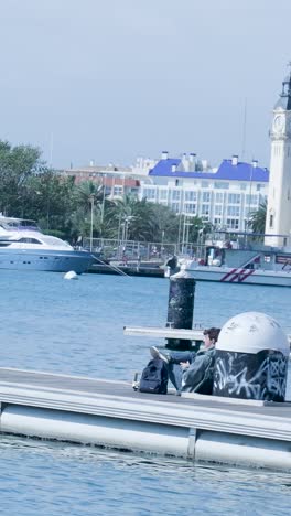 man relaxing on a waterfront pier