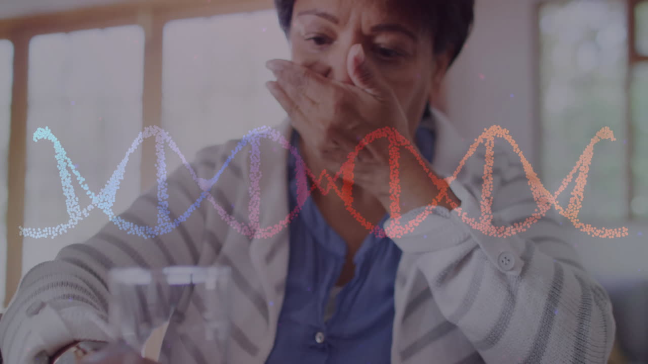 Animation of dna strand over senior biracial woman taking pills
