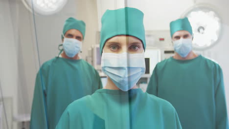 animación del procesamiento de datos sobre diversos cirujanos con máscaras faciales en el hospital