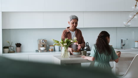 grandma and girl setting the table