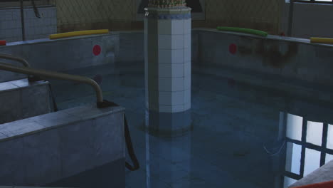 Old-bathtub-pool-with-column-in-the-middle-in-Tskaltubo-spa-in-Georgia