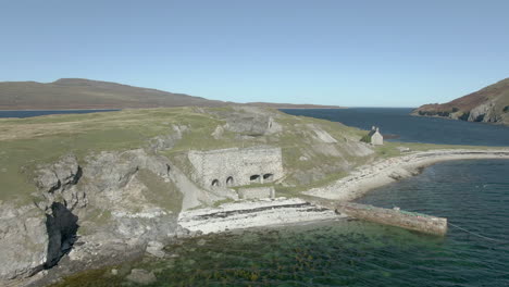 an aerial view of ard neakie abandoned lime kilns on a sunny summer's day