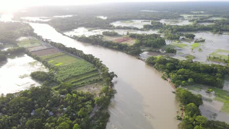 flooded overflown wild river with agricultural landscape