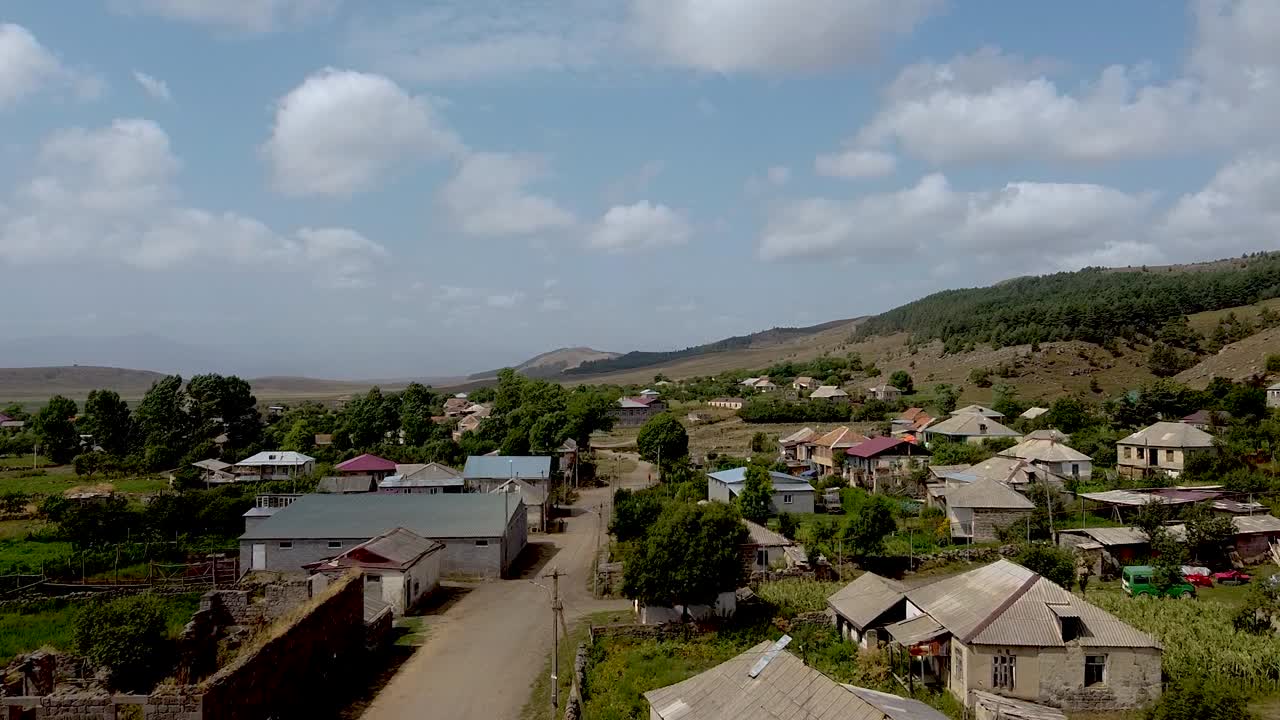 Follow a journey through a serene village located in the mountains. Discover traditional houses, lush landscapes, and a relaxed atmosphere. Enjoy the natural beauty and rural living