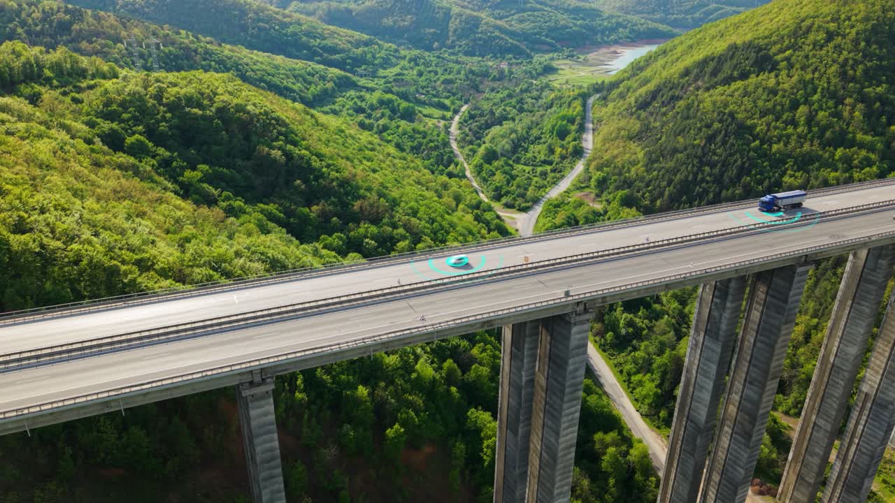 Cinematic aerial view of highway traffic featuring multiple autonomous cars and trucks surrounded by holographic data grids and scanning effects