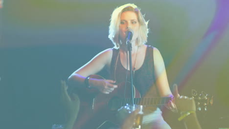 teenage girl singing on stage, with animated music notes floating over guitar, mic and lights