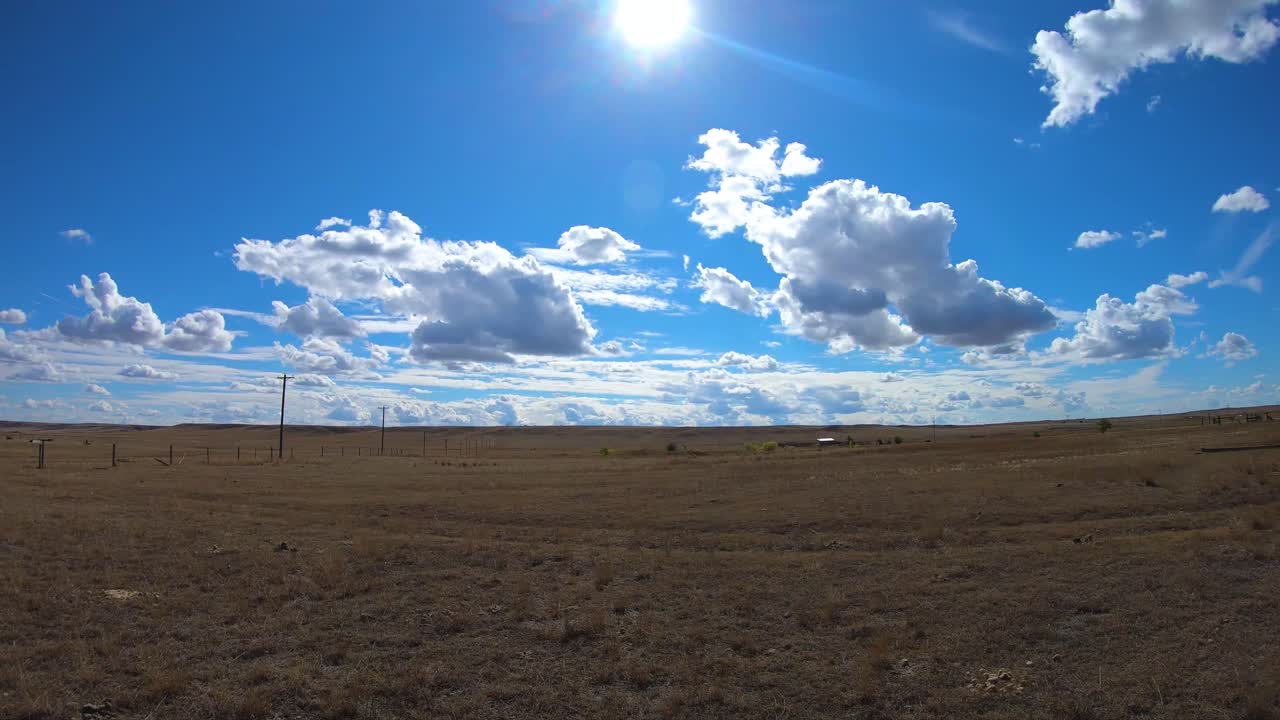 TIMELAPSE - Fast moving clouds over the prairies in Empress Alberta Canada on a sunny day